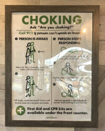  Image in a restaurant with instructions about how to care for someone choking